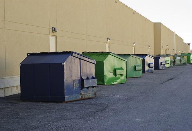 red and green waste bins at a building project in Cedarville